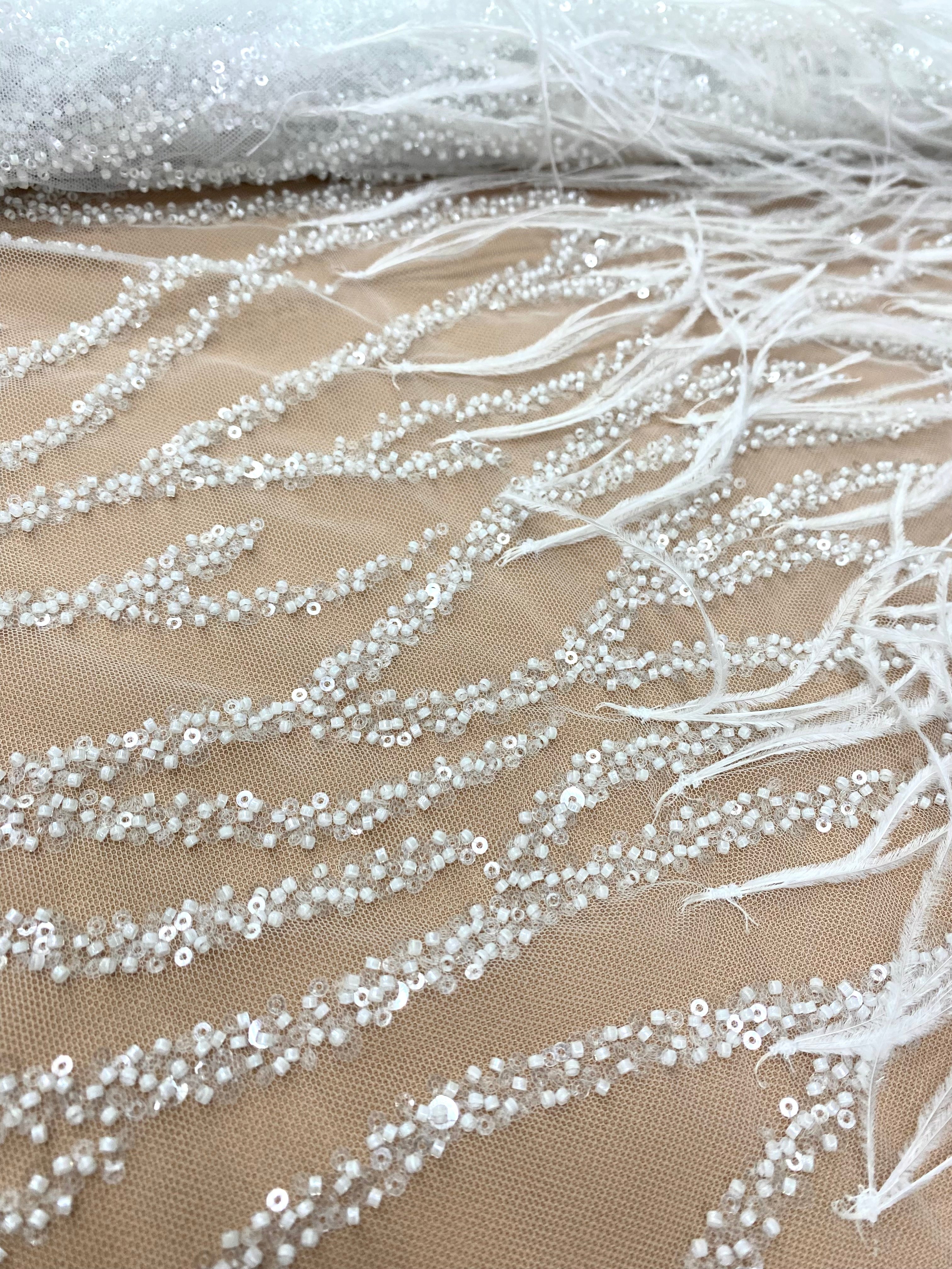 Ivory Couture Lace with Ostrich Feathers, Strings, Beads and Sequins